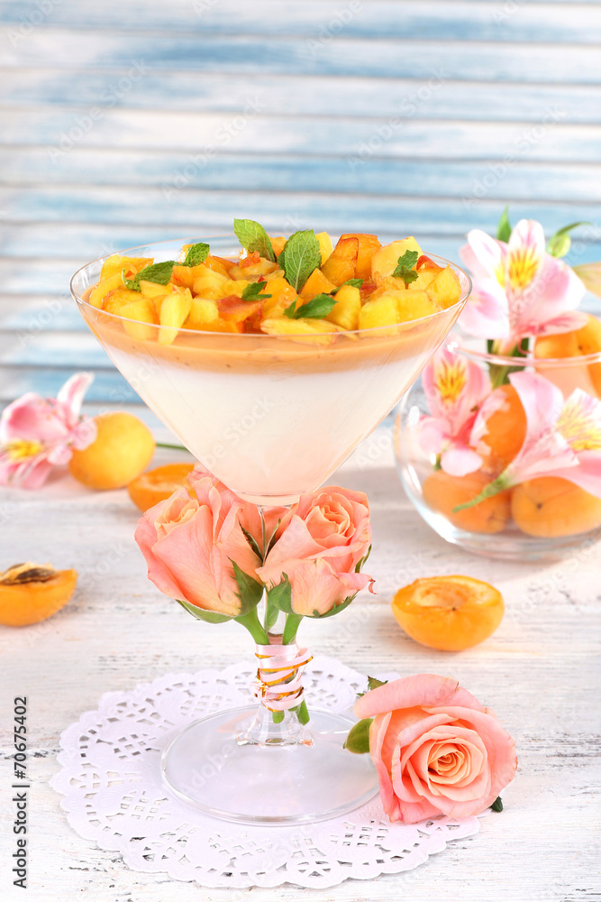 Apricot dessert in glass on table close-up
