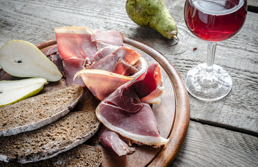 Wall Mural - Slices of italian ham on the wooden board