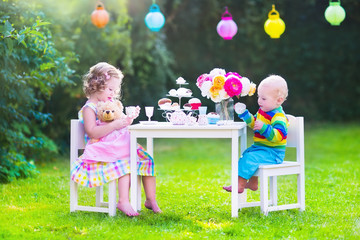 Little children at doll tea party