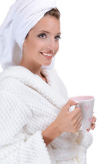 Canvas Print - Beautiful young girl in bathrobe with cup of coffee isolated