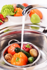 Wall Mural - Washing fruits and vegetables close-up