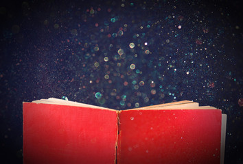 Poster - open red book and glowing glittering lights