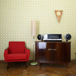 © Khorzhevska - Vintage room with wallpaper, old fashioned armchair, retro playe