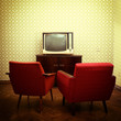 © Khorzhevska - Vintage room with two old fashioned armchairs and retro tvover o
