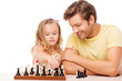Daughter and her father playing chess