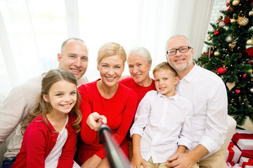 Canvas Print - smiling family making selfie at home