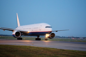 Wall Mural - Passenger planes at the airport in the evening