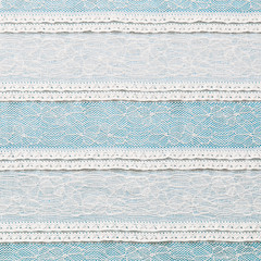 Ivory lace fabric on blue background