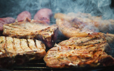 Grilled steaks on barbecue