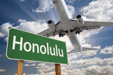 Honolulu Green Road Sign and Airplane Above