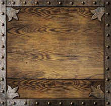 Medieval Metal Frame Over Old Wooden Background