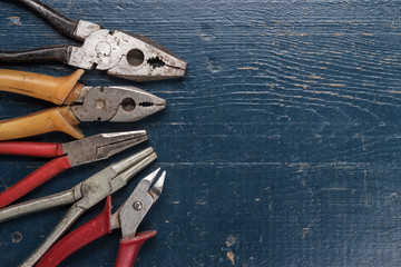 Poster - pliers on blue table