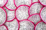 beautiful fresh sliced white with red rim dragon fruit  as backg