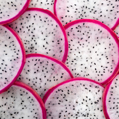 beautiful fresh sliced white with red rim dragon fruit  as backg