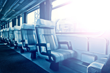 Passenger train interior with empty eats