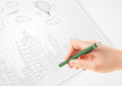 © ra2 studio - A person drawing sketch of a city with balloons and clouds on a