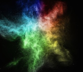 Wall Mural - colourful powder exploding isolated on black