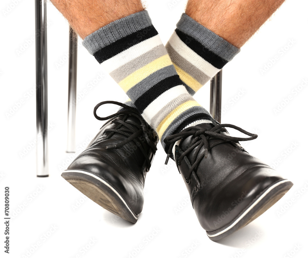 Man leg in suit and colorful socks, isolated on white