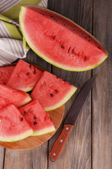 Wall Mural - Slice of watermelon on wooden table
