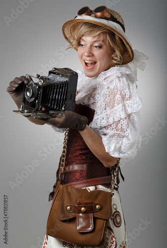 Naklejka - mata magnetyczna na lodówkę Beautiful happy woman with retro camera.