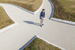 © Westend61 - Germany, Baden-Wurttemberg, Teenage boy standing at crossing