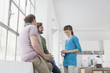 © Westend61 - Three colleagues communicating in a creative office