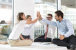 © Westend61 - Poland, Warsaw, four successful businessmen sitting on conference table
