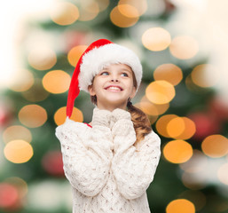 Wall Mural - dreaming girl in santa helper hat