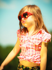 Wall Mural - Summer. Girl kid child in red sunglasses outdoor