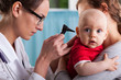 © Photographee.eu - Child's otolaryngologist doing ear examination