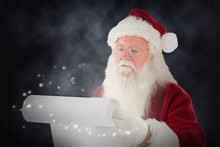 Composite Image Of Santa Claus Checking His List