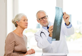 Canvas Print - senior woman and doctor meeting