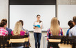 © Syda Productions - group of smiling students in classroom