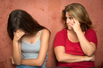 Wall Mural - Sad crying teenage girl and her worried mother