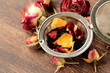 natural organic tea from dry roses on a wooden background