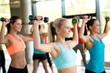© Syda Productions - group of women with dumbbells in gym