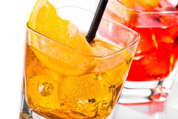 close-up of cocktail with orange slice on top isolated