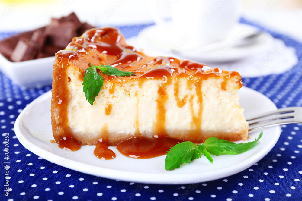 Cheese cake and cup of coffee on polka dot tablecloth