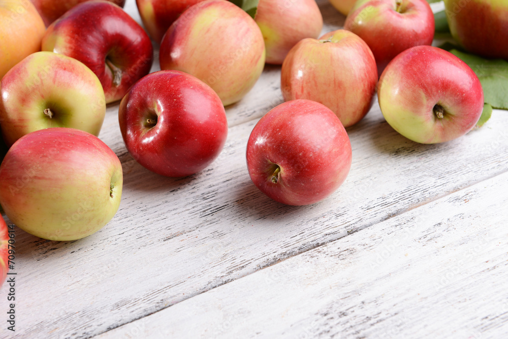 Sweet apples on wooden background