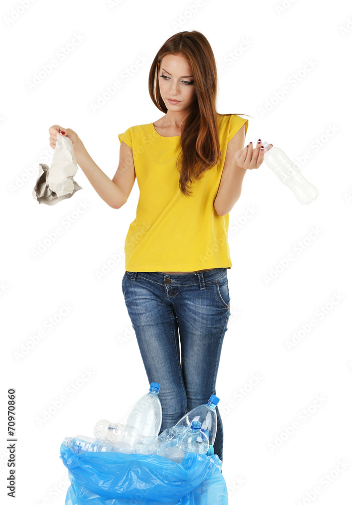 Young girl sorting paper and cardboard isolated on white