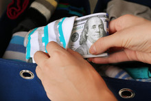 Woman Hiding Money In Sock Close Up