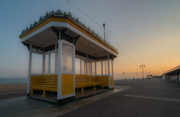 Beach front shelter and public benches on the English coast