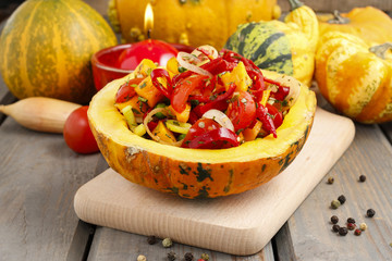 Wall Mural - Vegetable salad served in pumpkin