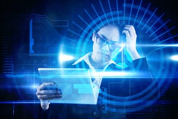 Poster - Composite image of thinking businesswoman looking at tablet pc