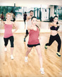 © Syda Productions - group of concentrated people exercising in the gym