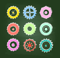 Wall Mural - Colored Cog Wheels Icons Set On Green Chalkboard