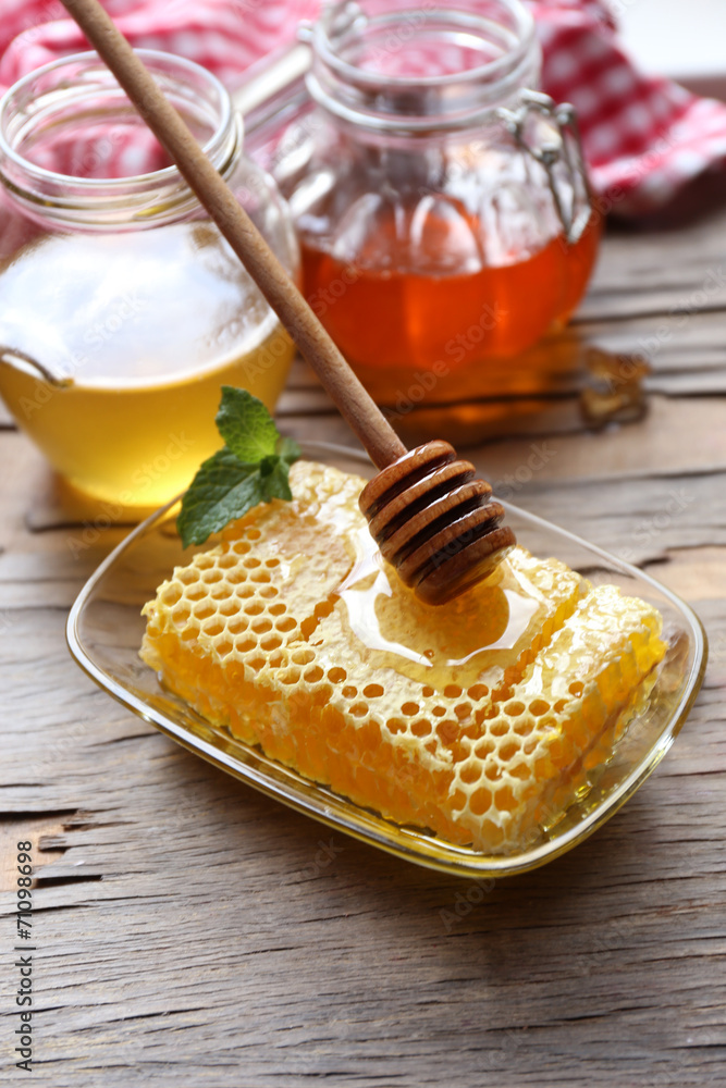 Fresh honey on wooden table