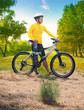 © stockphoto mania - young man wearing rider suit with safety helmet and mountain bic