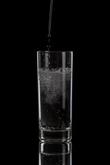 Sticker - pouring mineral water in simple highball glass