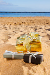 Canvas Print - pile of christmas gifts on beach